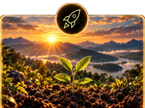 A seedling growing from rich soil at sunrise over mountains.
