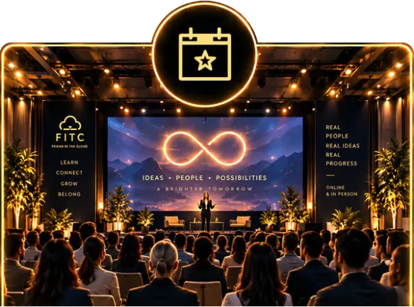An audience watching a speaker on a stage lit in gold.
